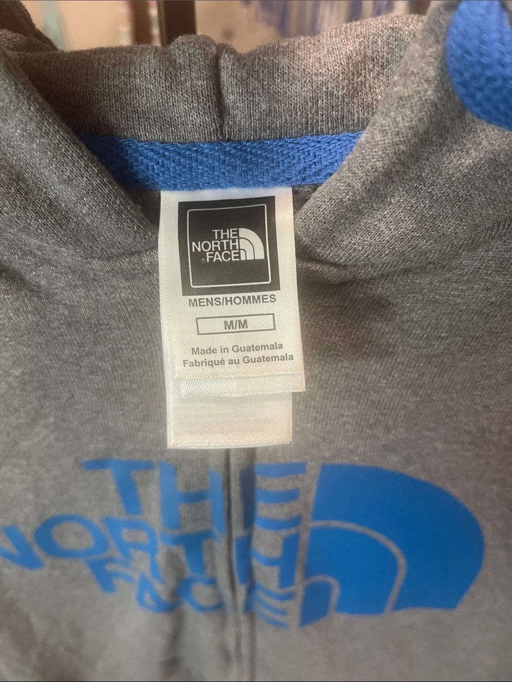 The North Face Gray Zip-Up Hoodie with Blue Logo
